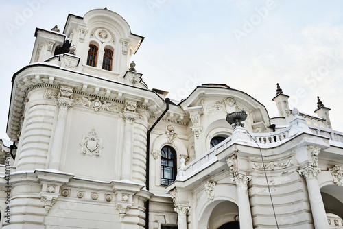 Facade of beautiful rich, white merchant's house, old manor with columns and stucco, estate of Aseev. Built in 1904. Tambov, Russia.
