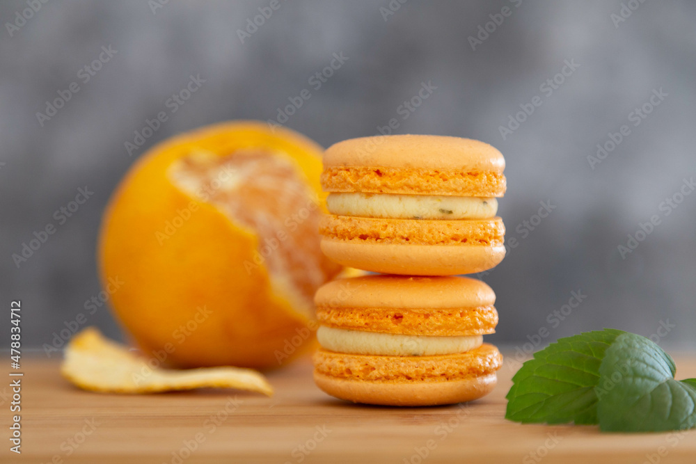 Mandarin macaroons on a wooden table. Mandarin macaroons on a wooden table.