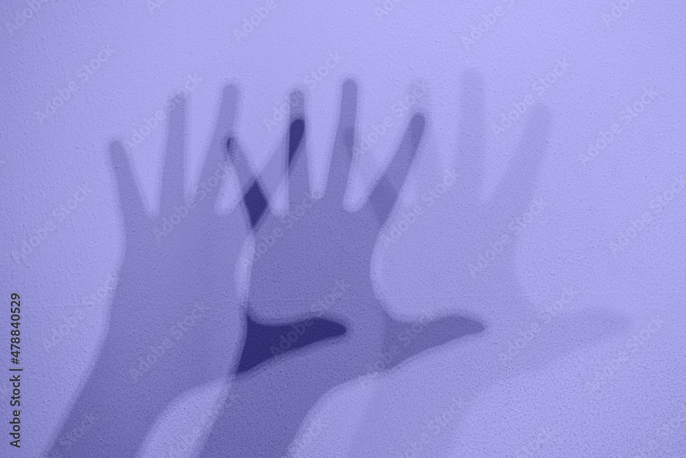 Monochrome shadows of a hand dancing to the music. Interactive exposition in science museum. Banner in trendy 2022 color.