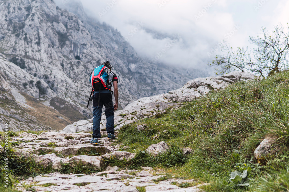 hiker on the top of mountain