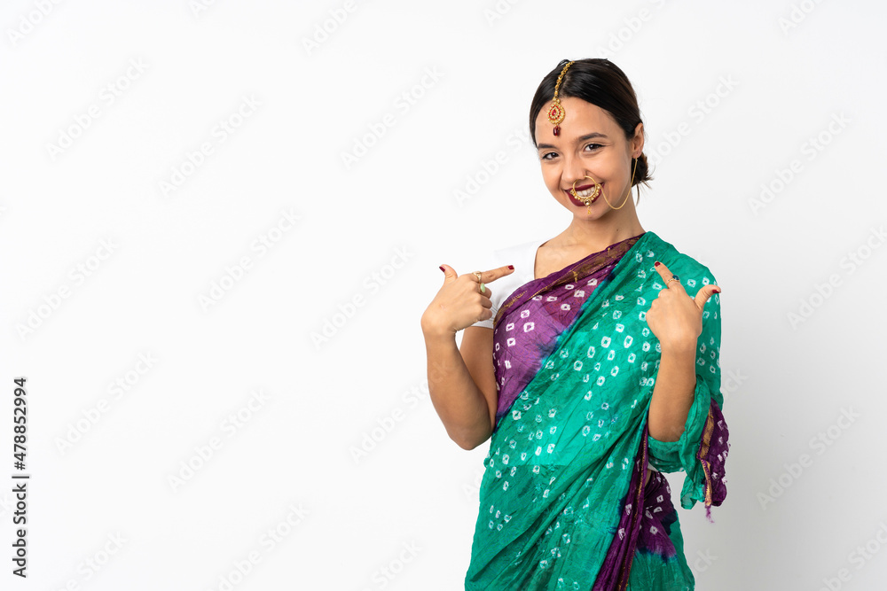 Young indian woman isolated on white background giving a thumbs up gesture Young indian woman isolated on white background giving a thumbs up gesture