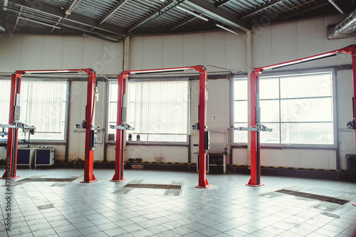 car lift in car service with soft focus, car maintenance