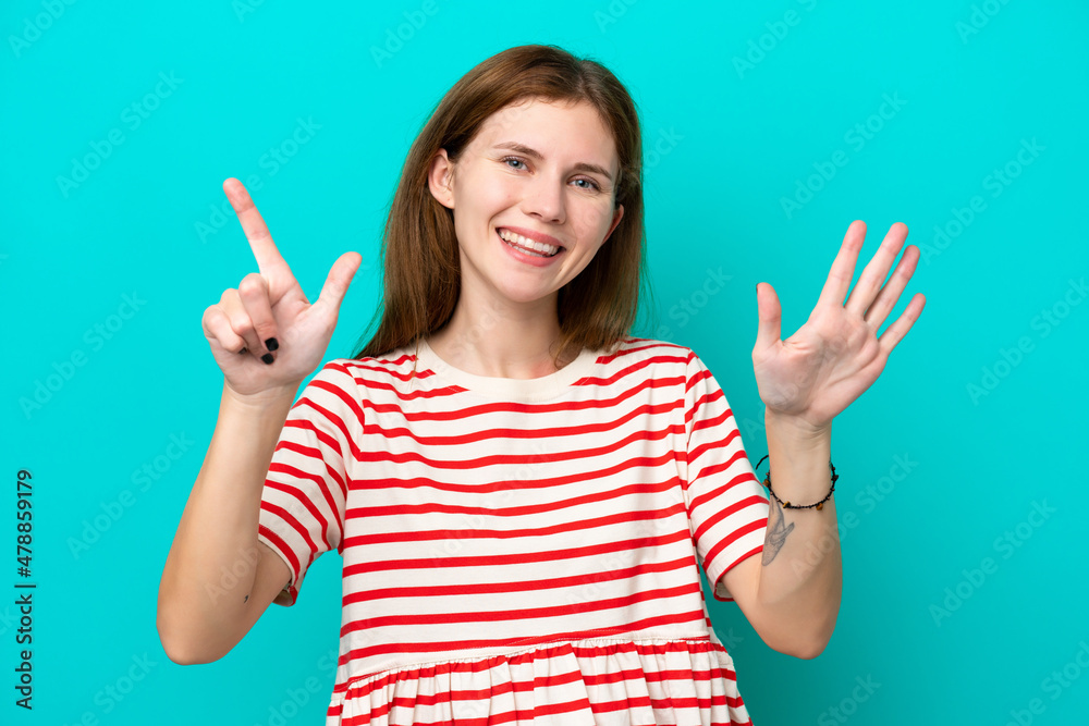 Young English woman isolated on blue background counting seven with fingers Young English woman isolated on blue background counting seven with fingers