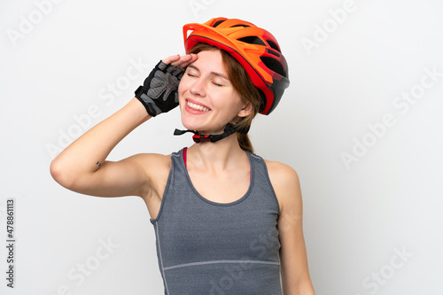 Young cyclist English woman isolated on white background smiling a lot