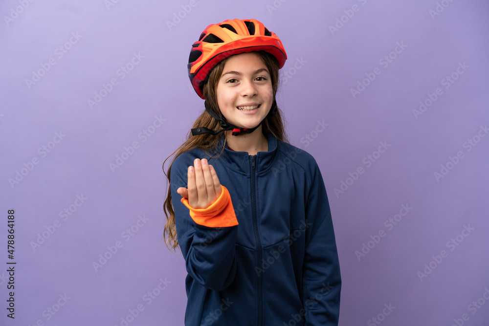Little caucasian girl isolated on purple background inviting to come with hand. Happy that you came Little caucasian girl isolated on purple background inviting to come with hand. Happy that you came