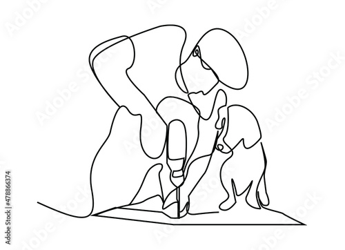 man fixing things at home with his dog