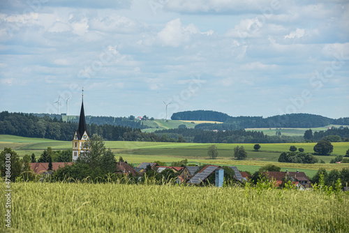 Solaranlagen in dörflicher Umgebung mit Windrädern im Hintergrund Hilpensberg Heiligenberg Röhrenbach photo