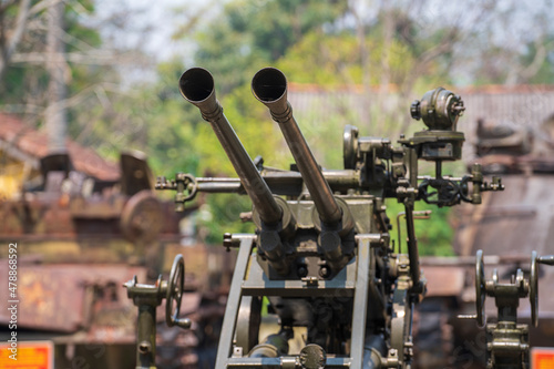 37mm anti aircraft artillery in outdoors museum in Ho chi Minh city, Vietnam, closeup double barrelled gun photo