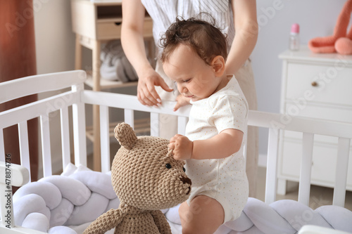 Cute little baby in crib