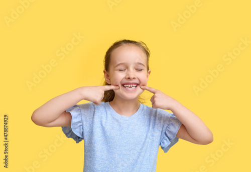 Portrait of happy little gi...