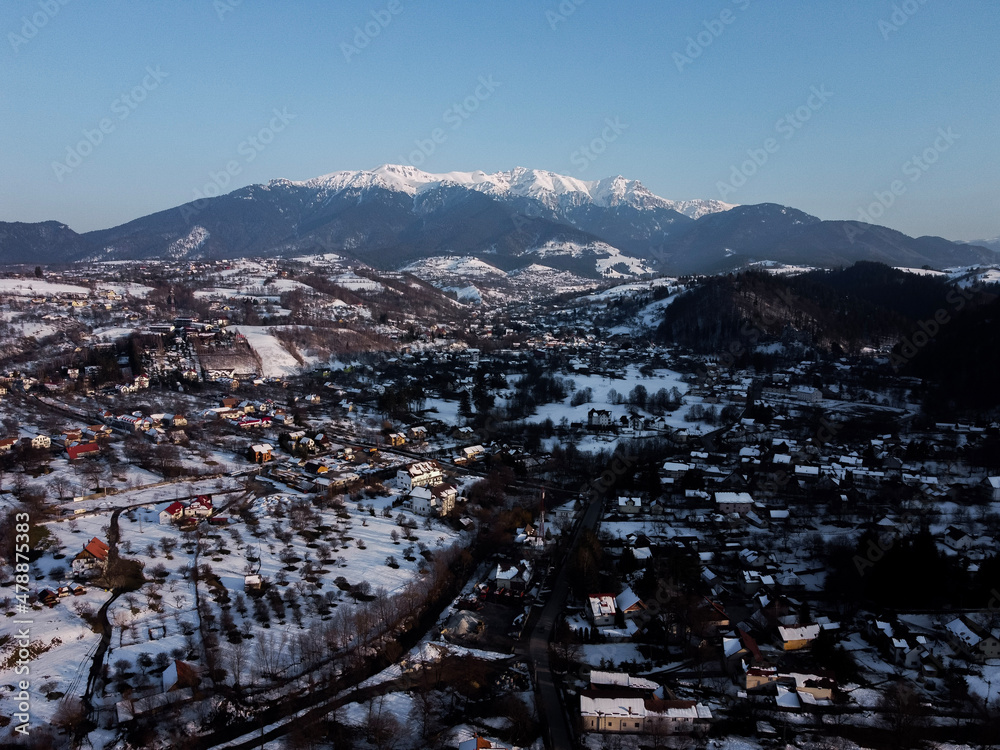 Bucegi Mountains seen from the city of Bran, Romania. Beautiful winter landscape. Part of the Carpathians Mountain Range.