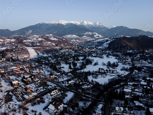 Bucegi Mountains seen from the city of Bran, Romania. Beautiful winter landscape. Part of the Carpathians Mountain Range. © Vlad