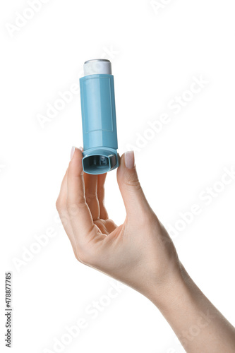 Female hand with asthma inhaler on white background