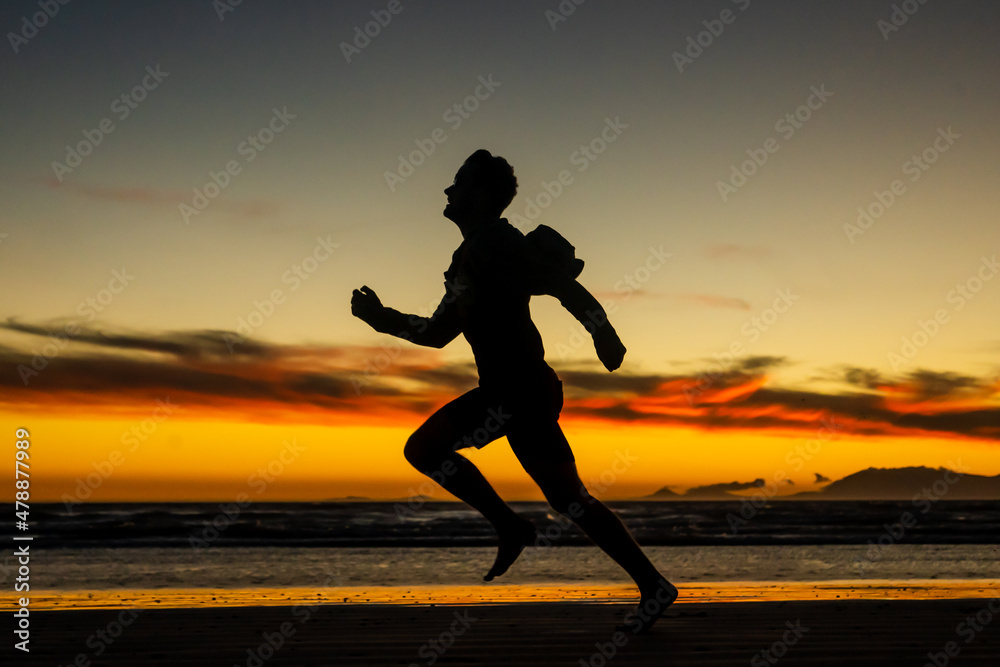 Running on the beach jogging exercise active sprinting selective focus beach background