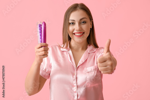 Young woman with sex toys s...