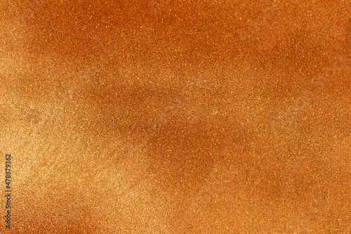 Orange gold glitter background texture. 