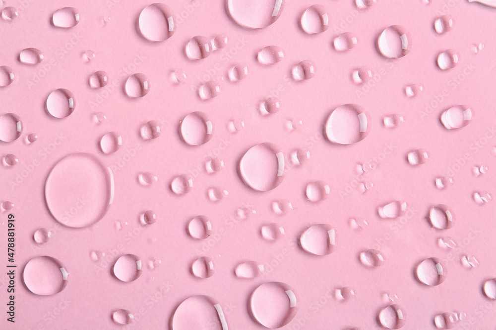 Drops of water on pink background, closeup Drops of water on pink background, closeup