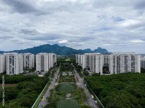 Aerial view of Cidade Jardim, in Jacarépagua in Rio de Janeiro, Brazil. Residential buildings and mountains in the background. Cloudy day. Drone photo photo