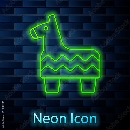 Glowing neon line Pinata icon isolated on brick wall background. Mexican traditional birthday toy. Vector