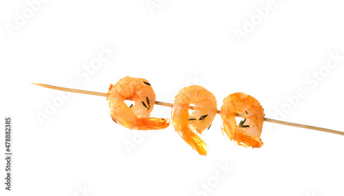 Three cooked shrimp skewere...