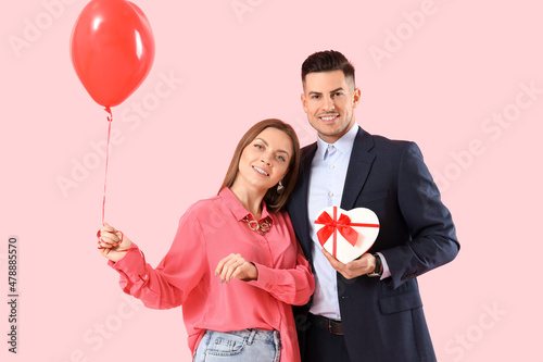 Happy young couple with gif...