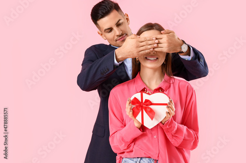 Happy young couple with gif...