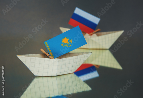 ships with flags of Kazakhstan, Russia, and other members of the alliance  photo