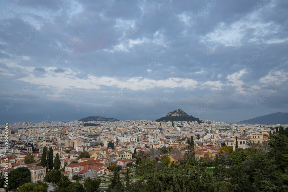 View of the city of Athens November.  Evening landscape, blue sky with clouds, soft light. Picturesque view from the hill to the old town.