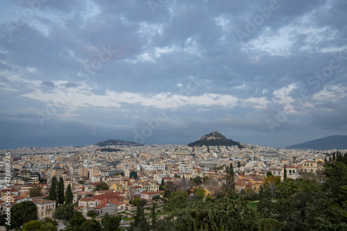 View of the city of Athens November. Evening landscape, blue sky with clouds, soft light. Picturesque view from the hill to the old town.