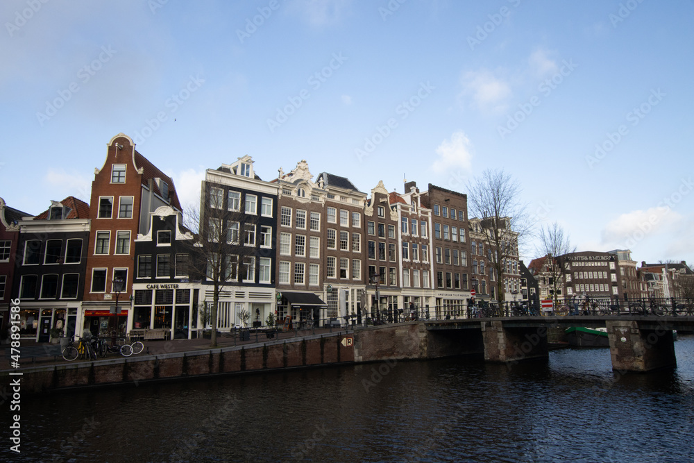 Houses and blue sky in Amsterdam, The Netherlands. Dutch architecture