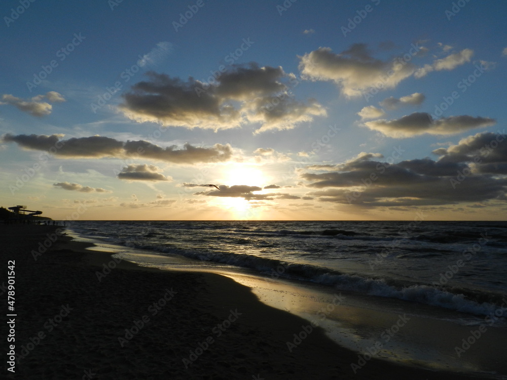 Beautiful sunset on the Baltic Sea. A walk along the seashore during your vacation. Perfect wallpaper.