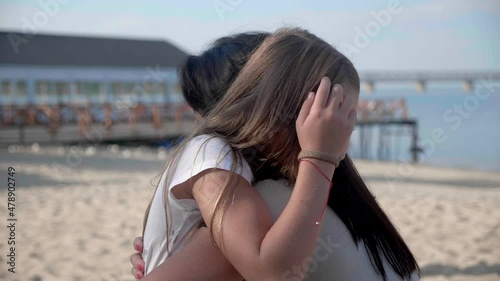 Happy cute affectionate adopted little kid girl hugging foster care parent mother with eyes closed, adorable small child daughter embrace mum cuddling enjoy tender sweet moment concept, close up view