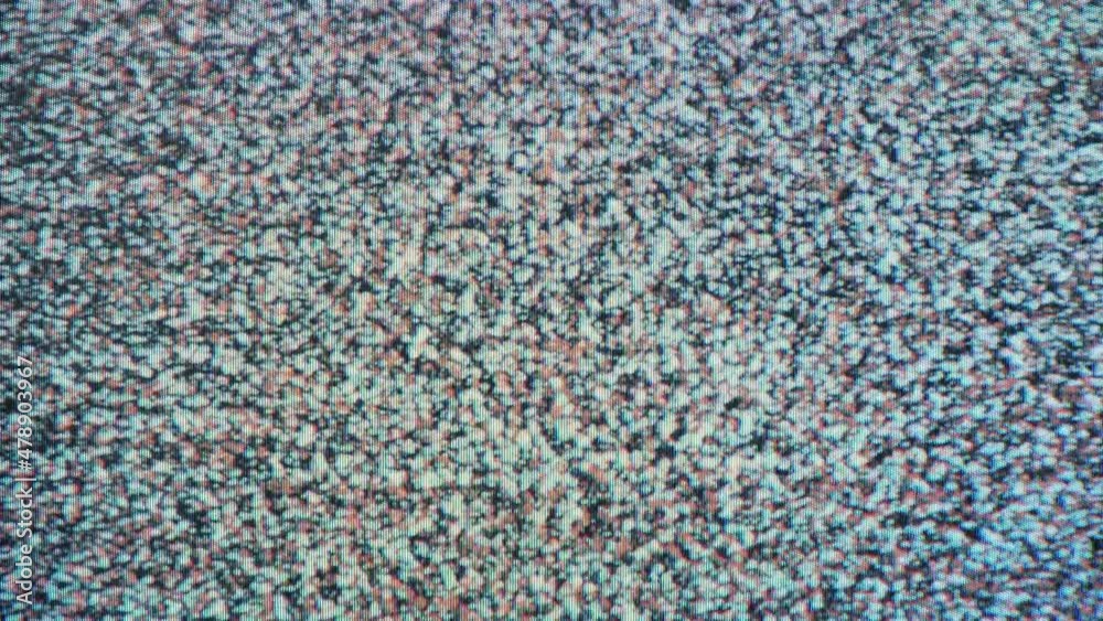 TV noise texture of the screen. Close-up of a television display. Analog black and white pattern. Looping background video with static snow signal. TV noise texture of the screen. Close-up of a television display. Analog black and white pattern. Looping background video with static snow signal.