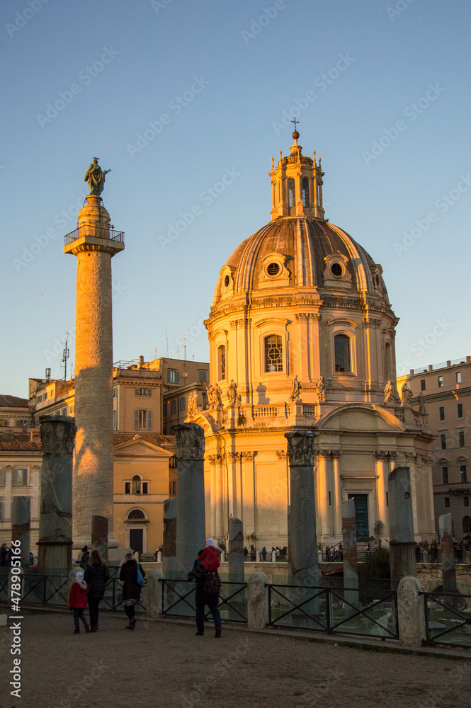 Blue sky above the Church of the Most Holy Name of Mary at the Trajan Forum and Trajan column in the sunset light in Rome, Italy