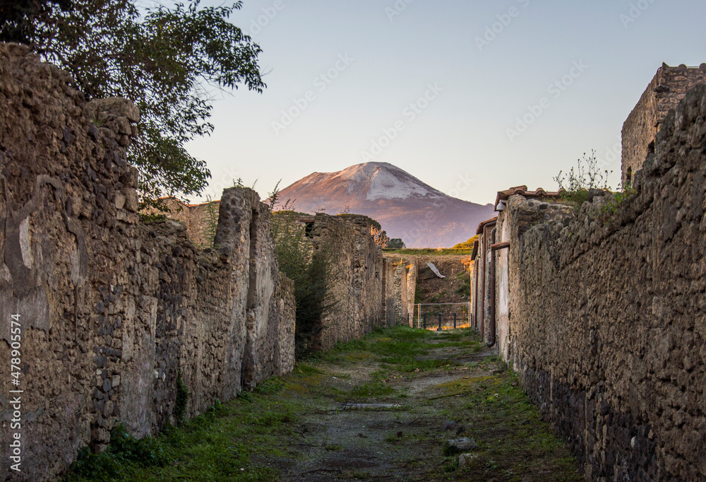 Ruines of the ancient Roman city of Pompeii and mount Vesuvius in the evening light, Italy Ruines of the ancient Roman city of Pompeii and mount Vesuvius in the evening light, Italy