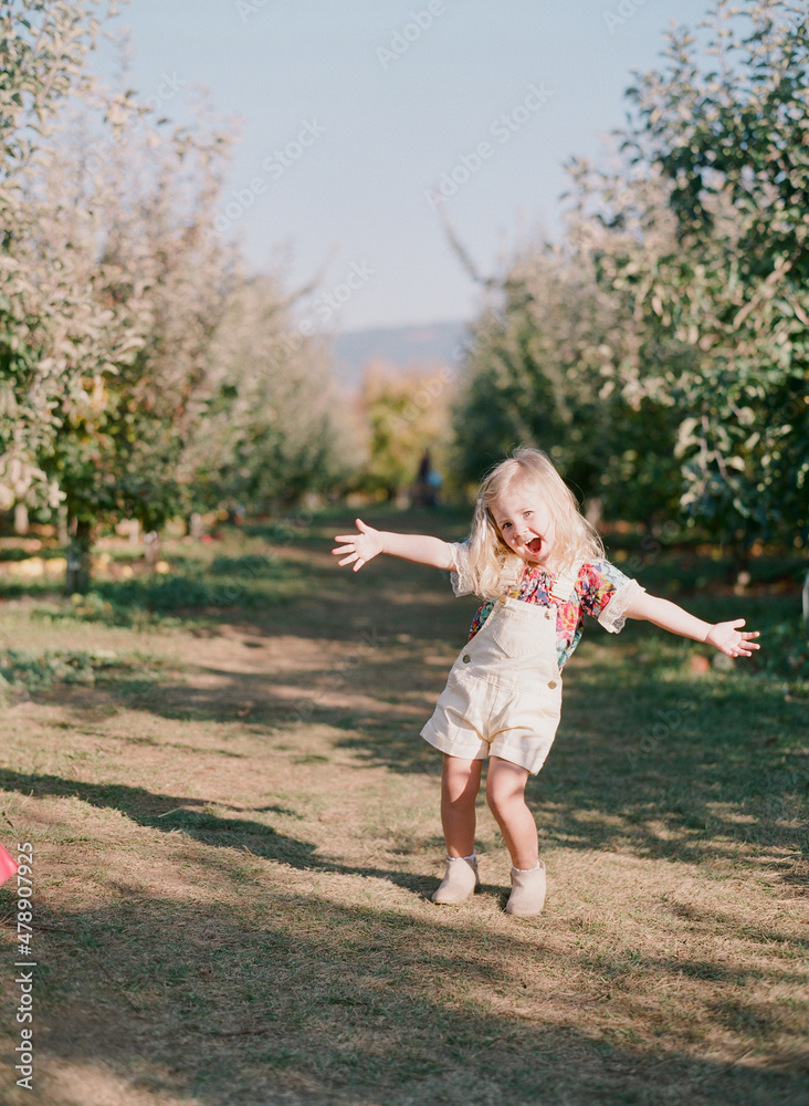 happy little girl at apple orchard happy little girl at apple orchard