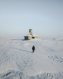 Abandoned house in the arctic and a man