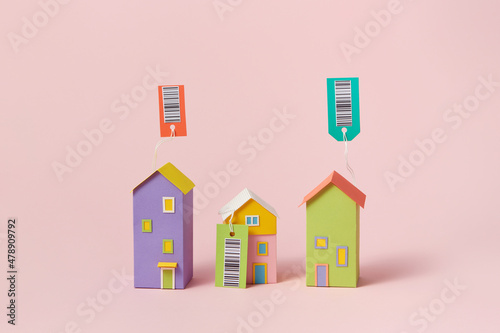 Papercraft houses with tags and barcodes