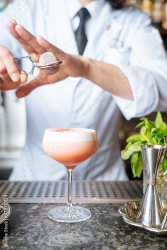 Bartender making cocktail
 photo