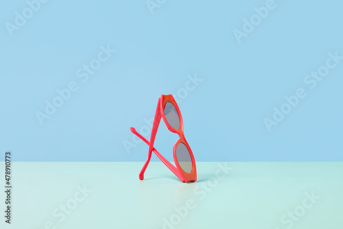 Stylish red sunglasses isolated in studio photo
