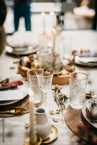 Close up of a Christmas table set with warm theme photo