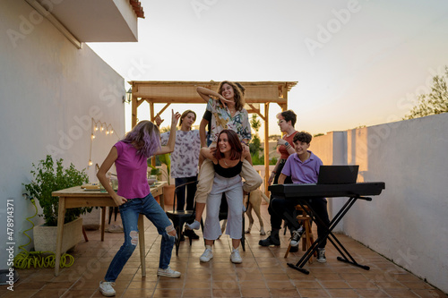 Teenagers partying on terrace photo