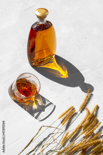 Glass and bottle of whiskey