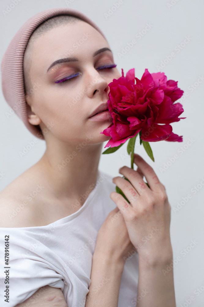 Woman with bright pink flower Woman with bright pink flower