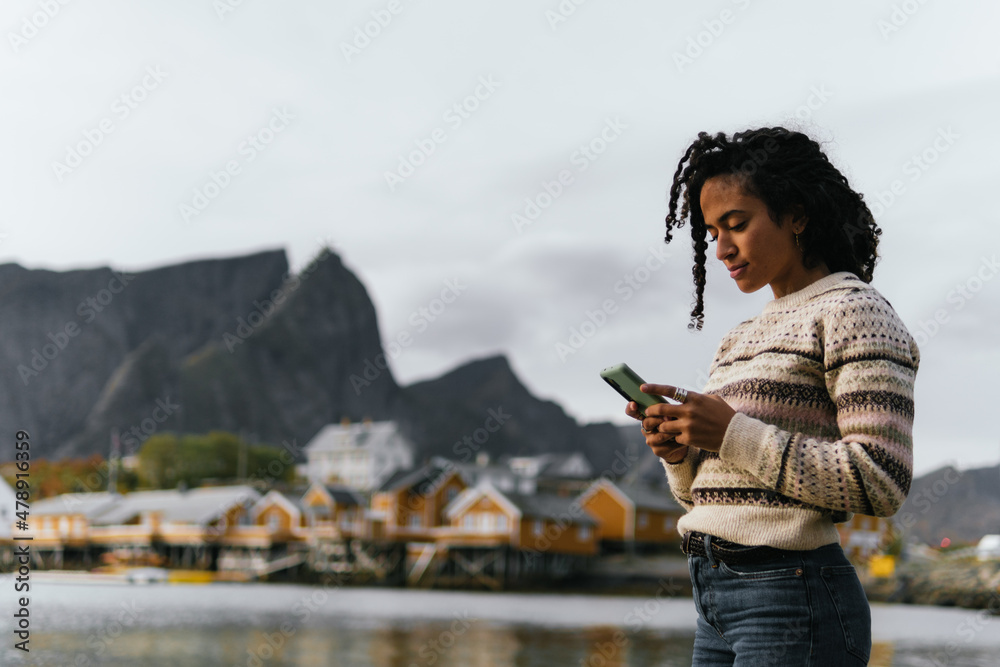 Arab traveler chatting on smartphone Arab traveler chatting on smartphone