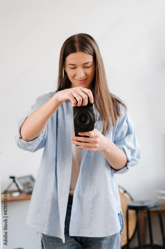 Smiling photographer in studio