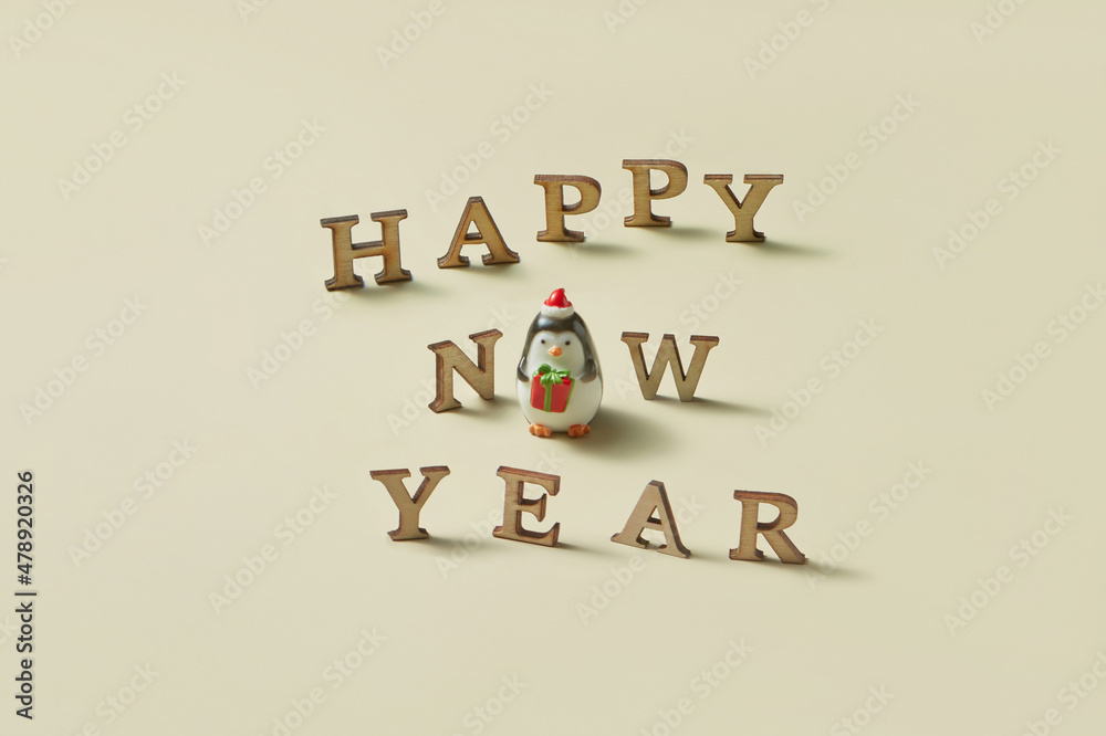 Penguin figurine with happy new year phrase Penguin figurine with happy new year phrase