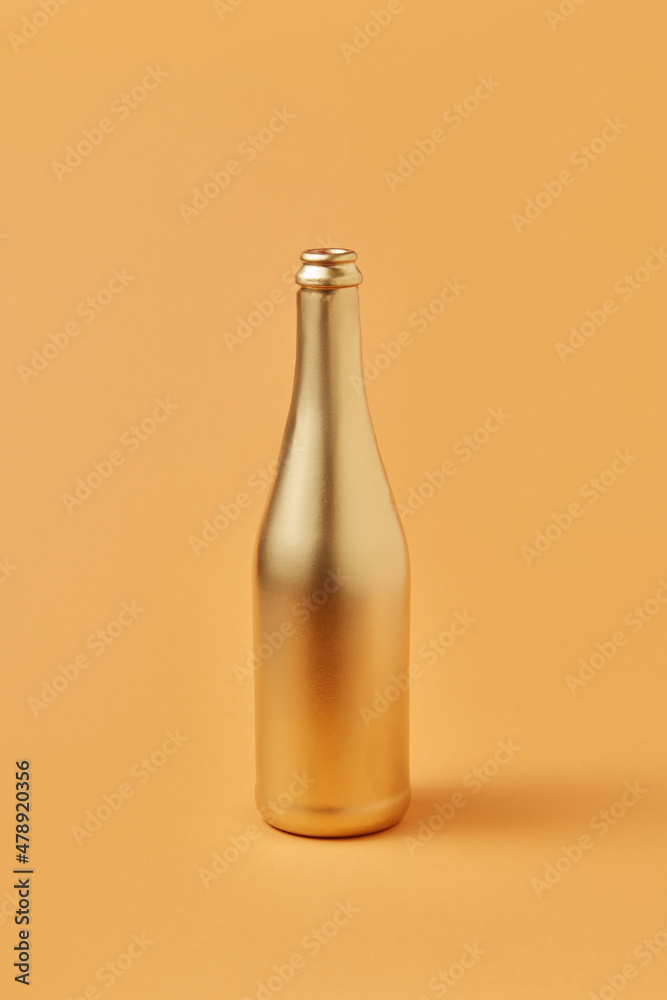 Bottle of champagne painted in golden color Bottle of champagne painted in golden color