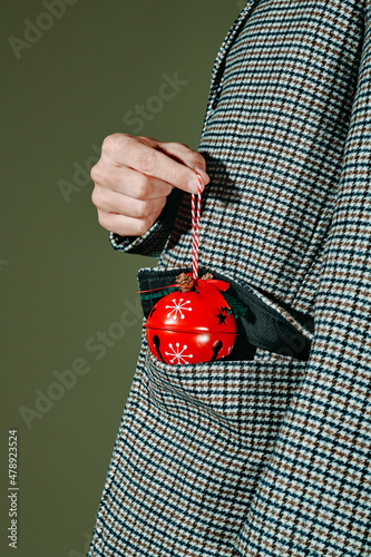 man with a christmas ball in his pocket
