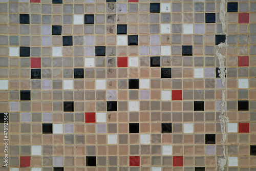 Vintage wall of tiny mosaic tiles